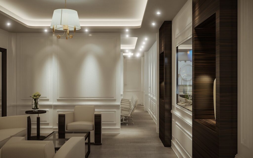Commercial 3D rendering of the J&CO Headquarter waiting room with cream-colored armchairs, a fish tank on the wall, and warm lights