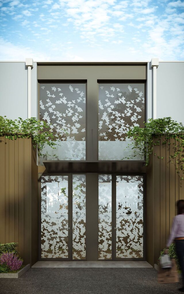Exterior 3D rendering of the main entrance at a small building decorated with plants at Vernier Flats