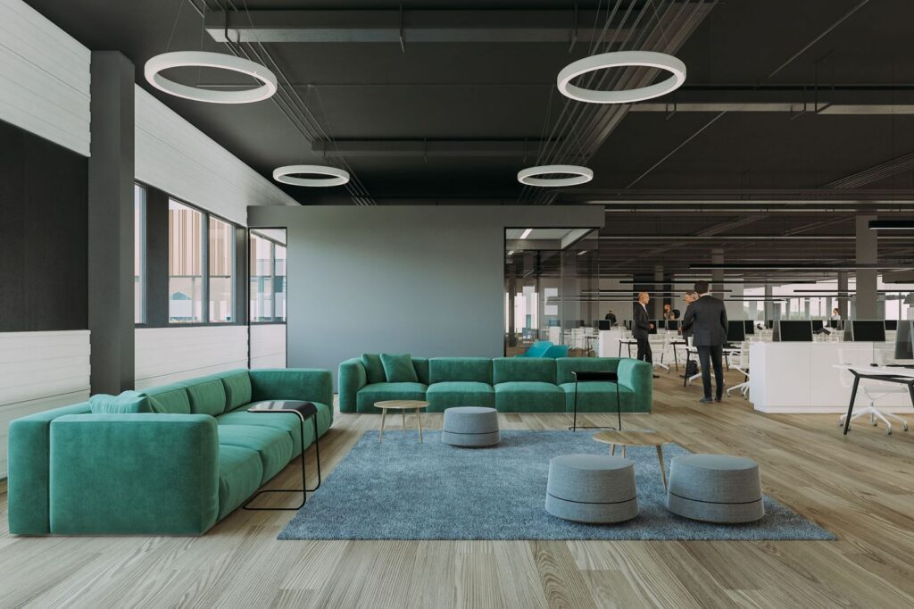 Industrial 3D rendering of the Cassiopee office with a break area with green armchairs, wooden floors and circular lamps