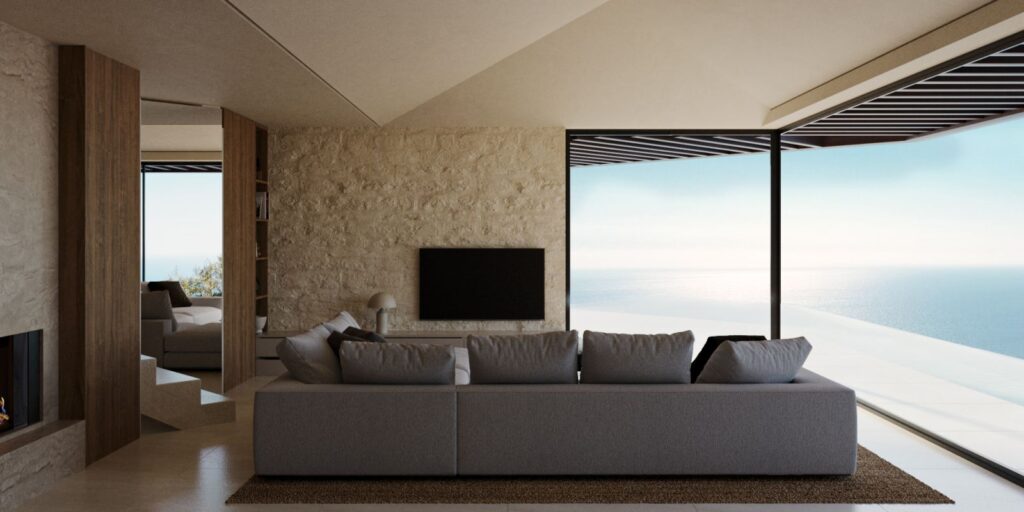 3D-Innendarstellung des Wohnzimmers in zwei Häusern mit viel natürlichem Licht, hellen Wänden, Holztüren und einem grauen Sofa